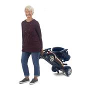 Golden Tech Buzzaround Carry-On Folding Travel Scooter with Travel Battery being transported by patient 2