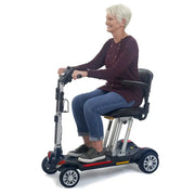 Golden Technologies Buzzaround Carry-On GB120 Scooter with rider