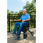 Miracle Mobility 4N1 Ultra Lite Electric Walker Wheelchair with patient using the wheelchair function