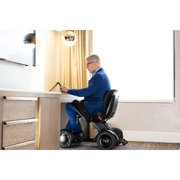 Whill C2 Premium Power Chair with patient doing desk work